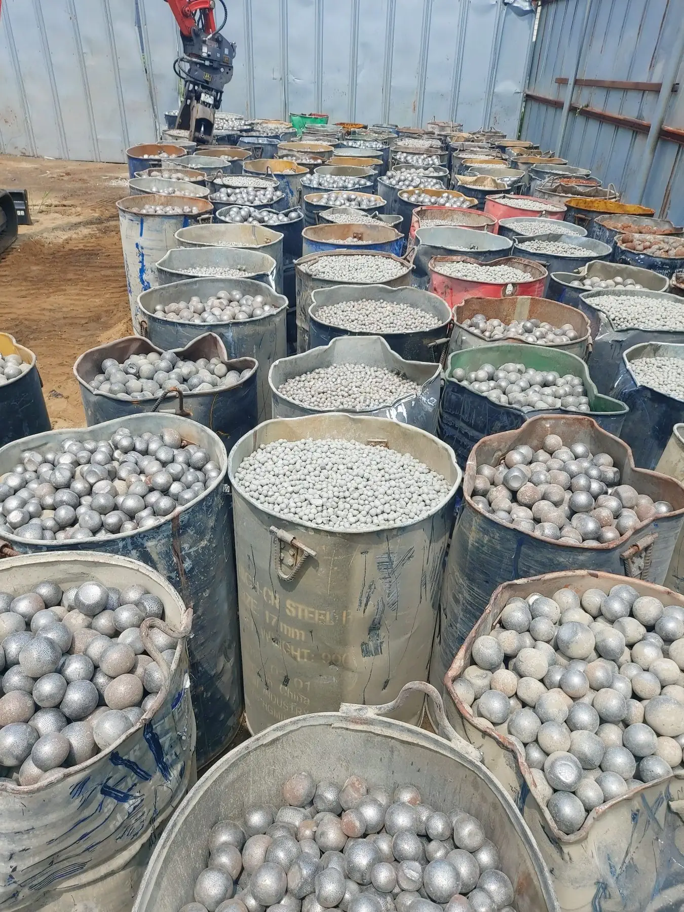 Rows of drums filled with used grinding media balls