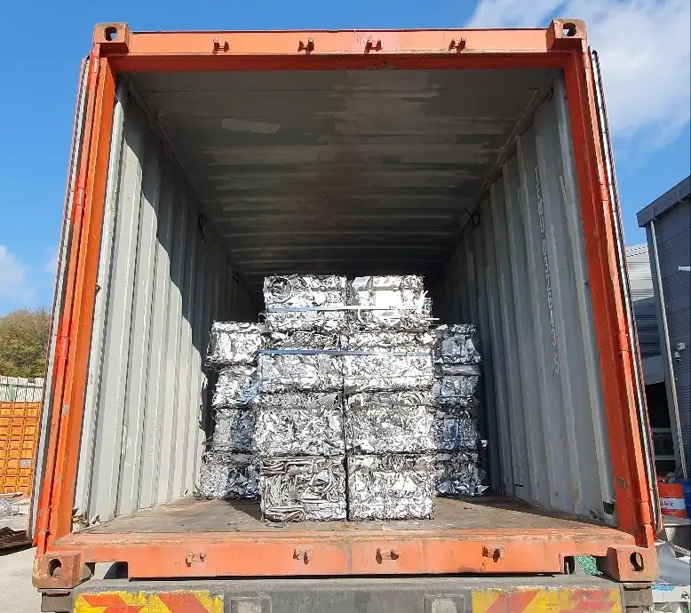 Bales of stainless steel scrap loaded into a shipping container
